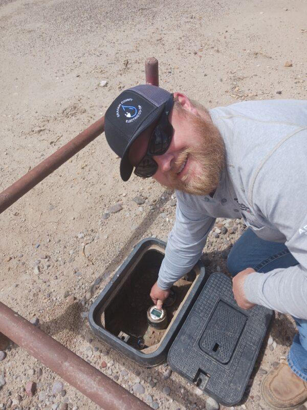 GCE employee working on meter